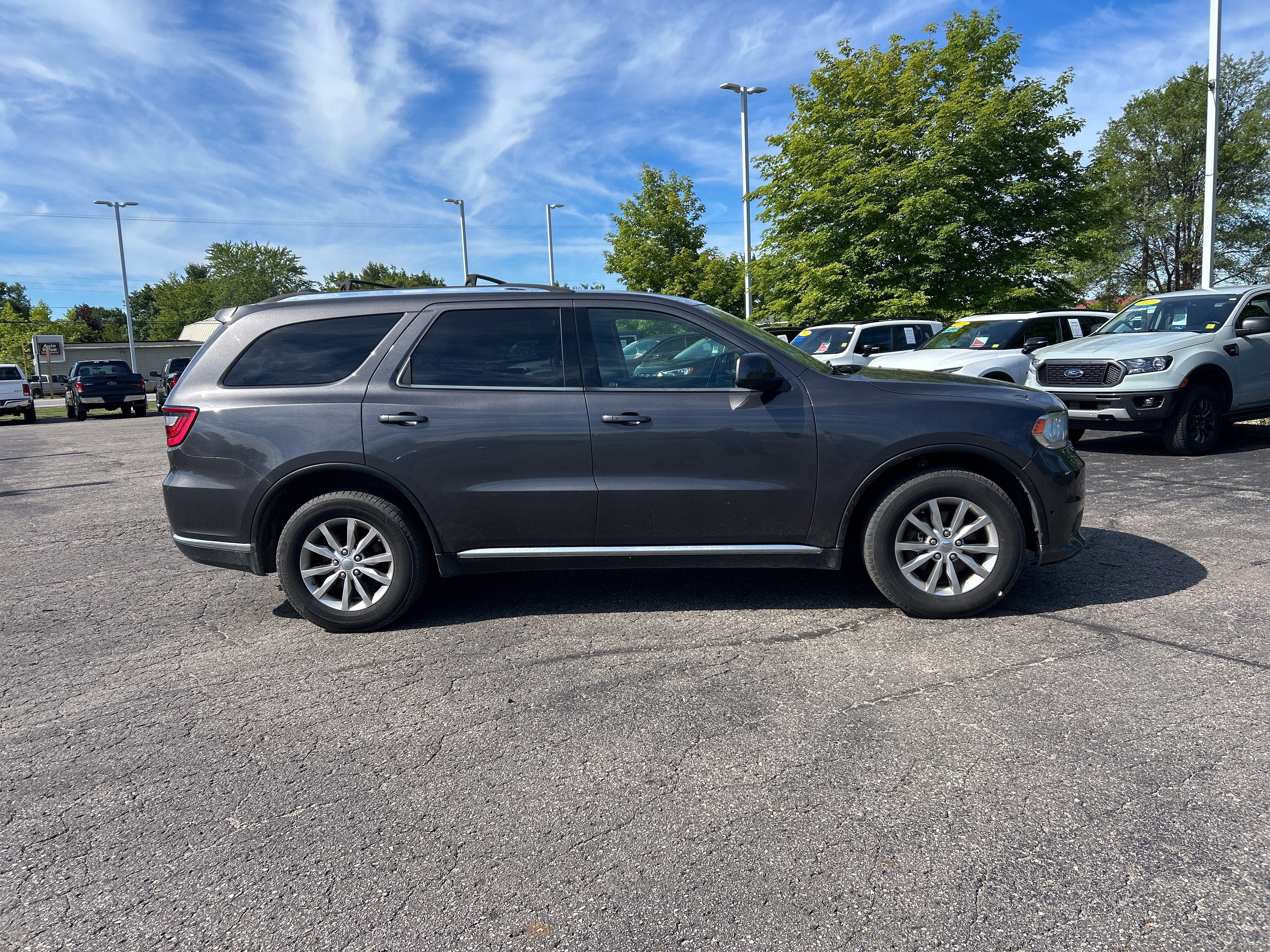 Used 2016 Dodge Durango SXT with VIN 1C4RDJAGXGC453886 for sale in Kalkaska, MI