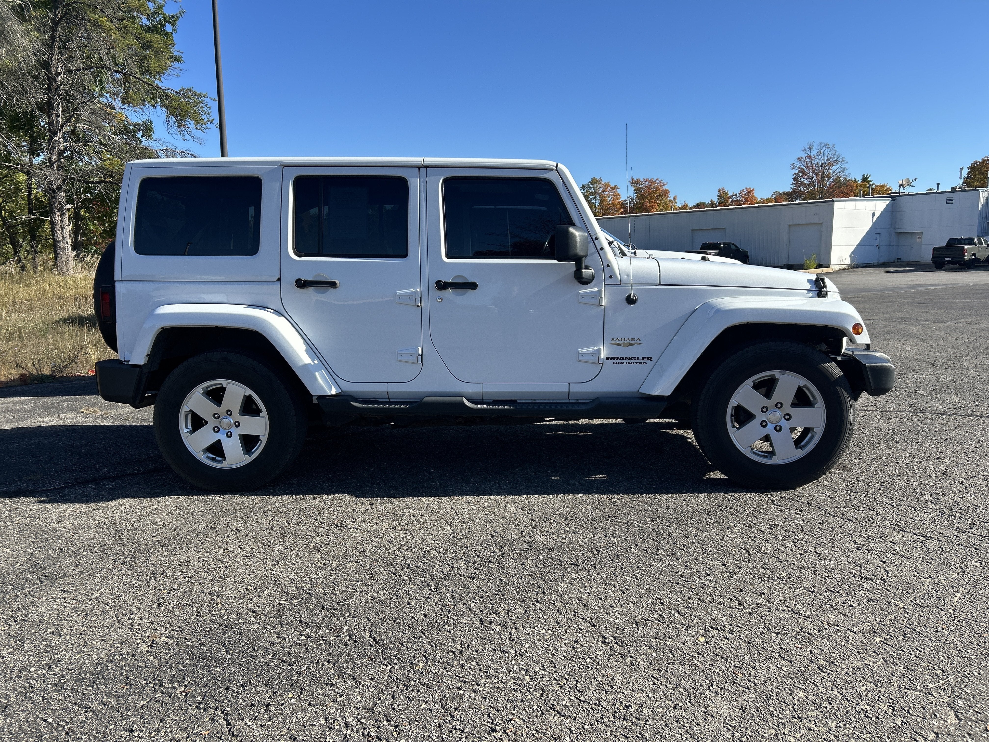 Used 2011 Jeep Wrangler Unlimited Sahara with VIN 1J4BA5H13BL624936 for sale in Kalkaska, MI